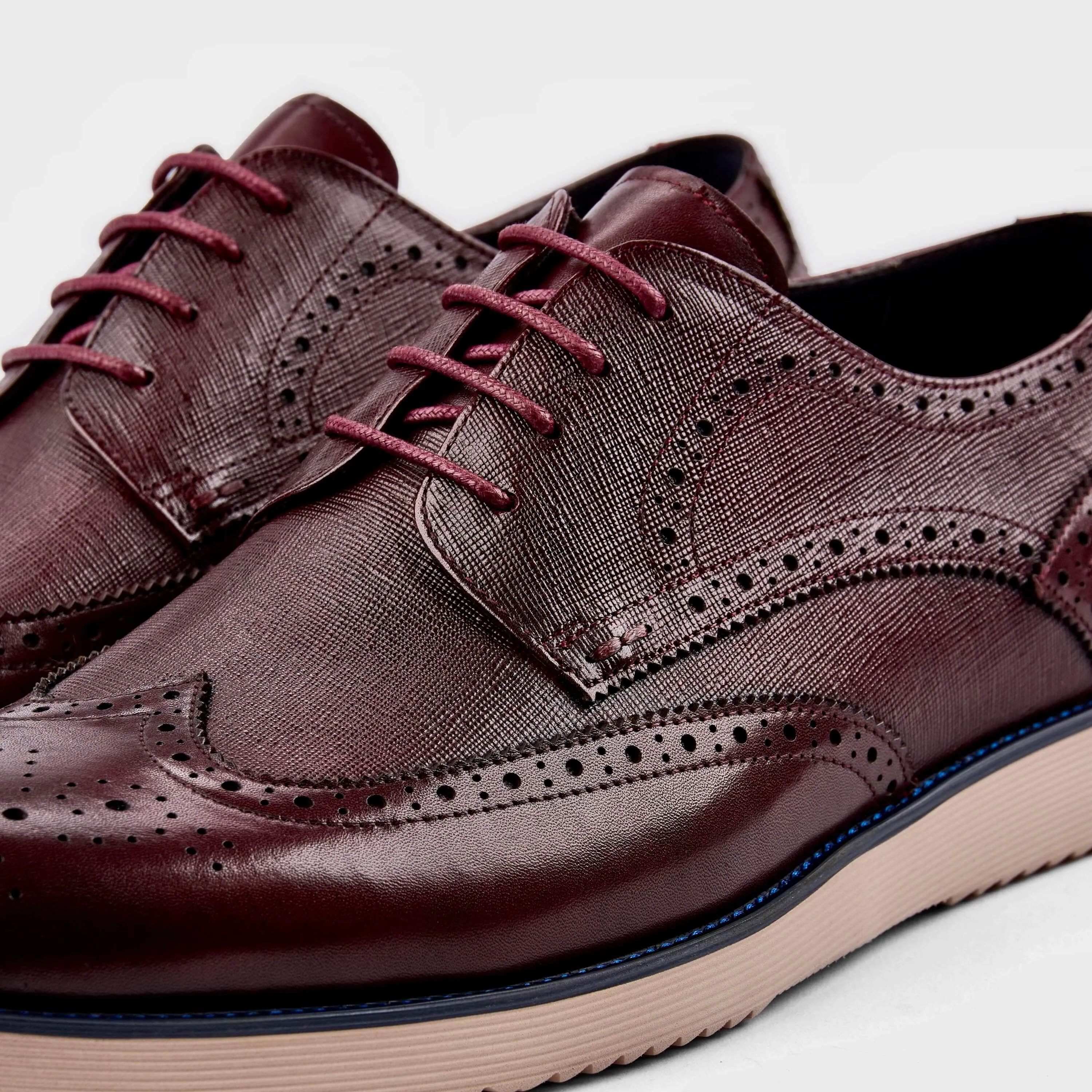 Burgundy Jasper Leather Wingtip Sneakers 2.0 with a Stylish Design